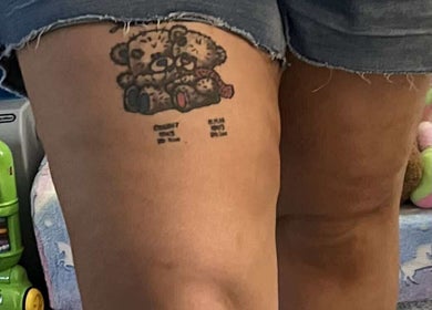 A detailed bear tattoo on a leg at Spray&Glow Leeds, showcasing creative tattoo artistry in Leeds, England, GB.