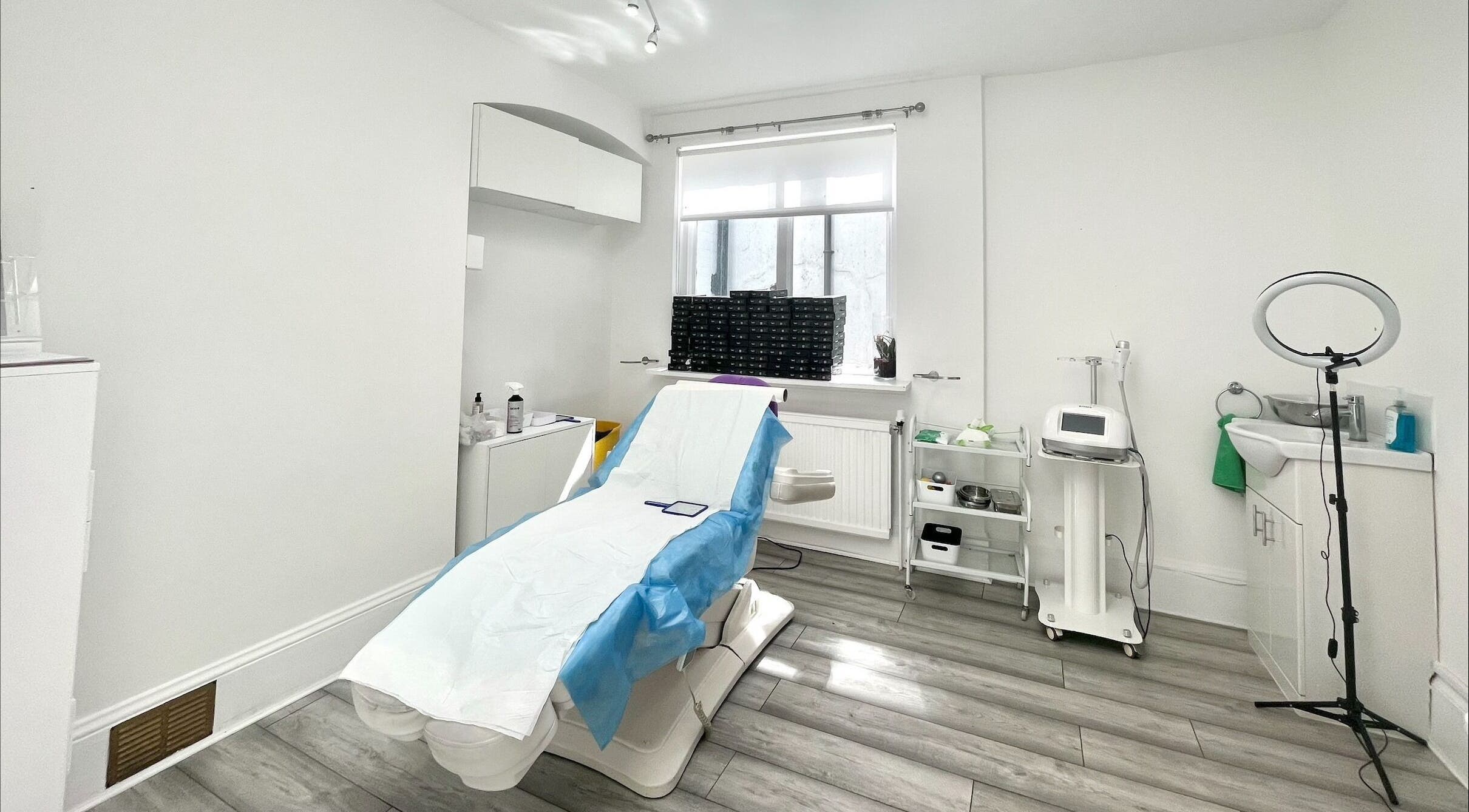 Calming treatment room at Pureskin Medical Cosmetics Clinic, London, England, GB, featuring modern equipment.