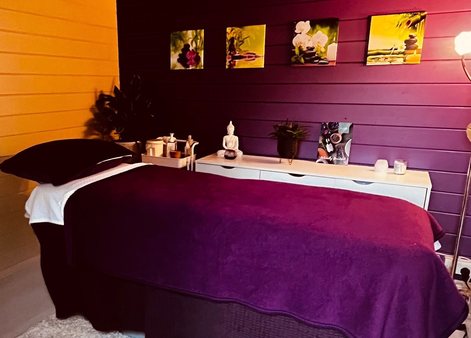 Cozy massage room at The Holistic Hideaway, Saint Neots, England, GB, with calming decor and dim lighting.
