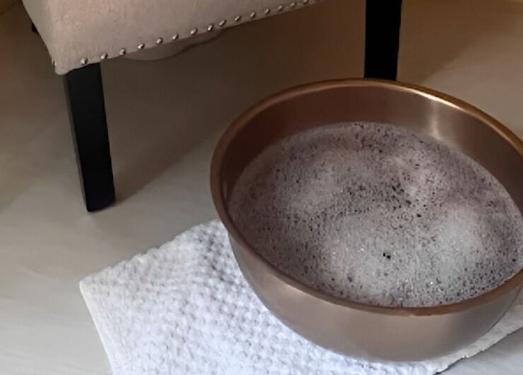 A soothing foot soak basin at The Holistic Hideaway, Saint Neots, England, GB, offering ultimate relaxation.