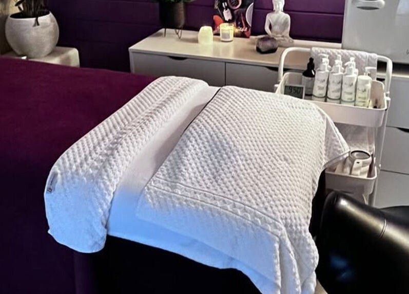 Relaxing massage table at The Holistic Hideaway in Saint Neots, England, GB, set for a soothing treatment.