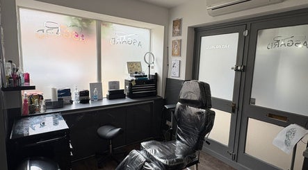 Modern piercing room at Asgard Body Piercing (Winchester), featuring sleek decor and comfortable seating in Winchester, England, GB.