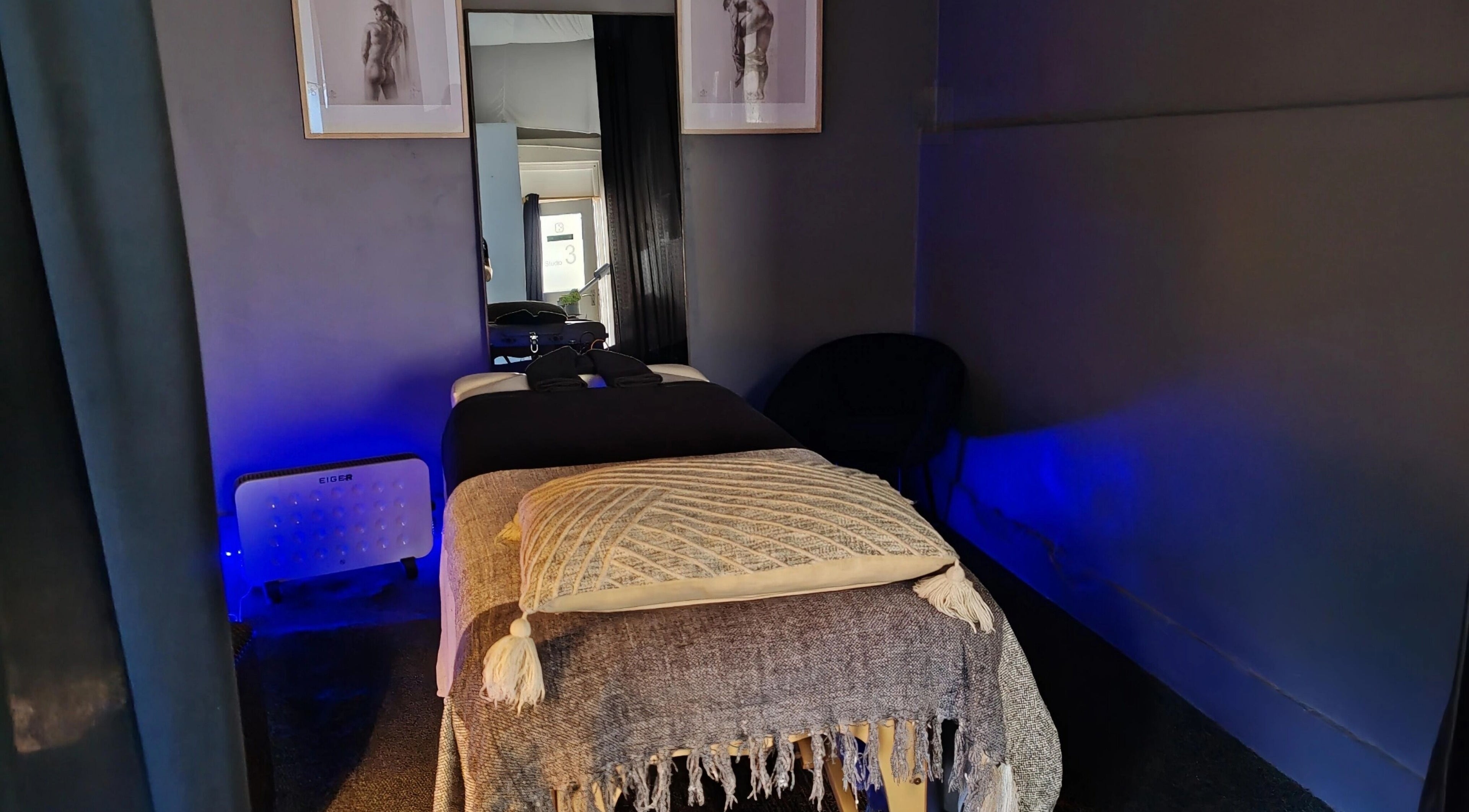 Cozy massage room at Body Shop Studio For Men, Cape Town, ZA with a relaxing ambiance.