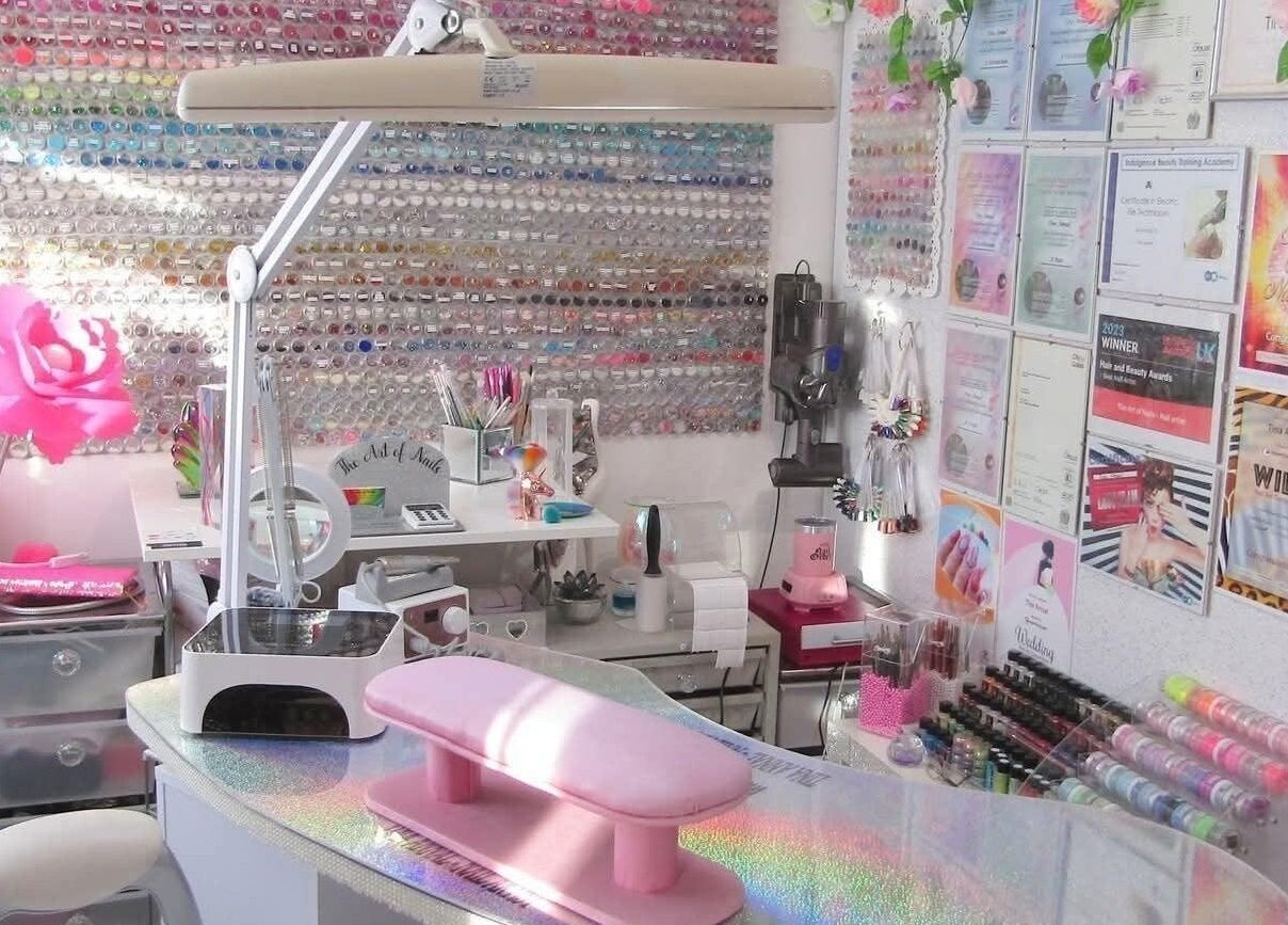 Vibrant nail studio at The Art of Nails, Trowbridge, England, GB, showcasing colorful polish and decor.
