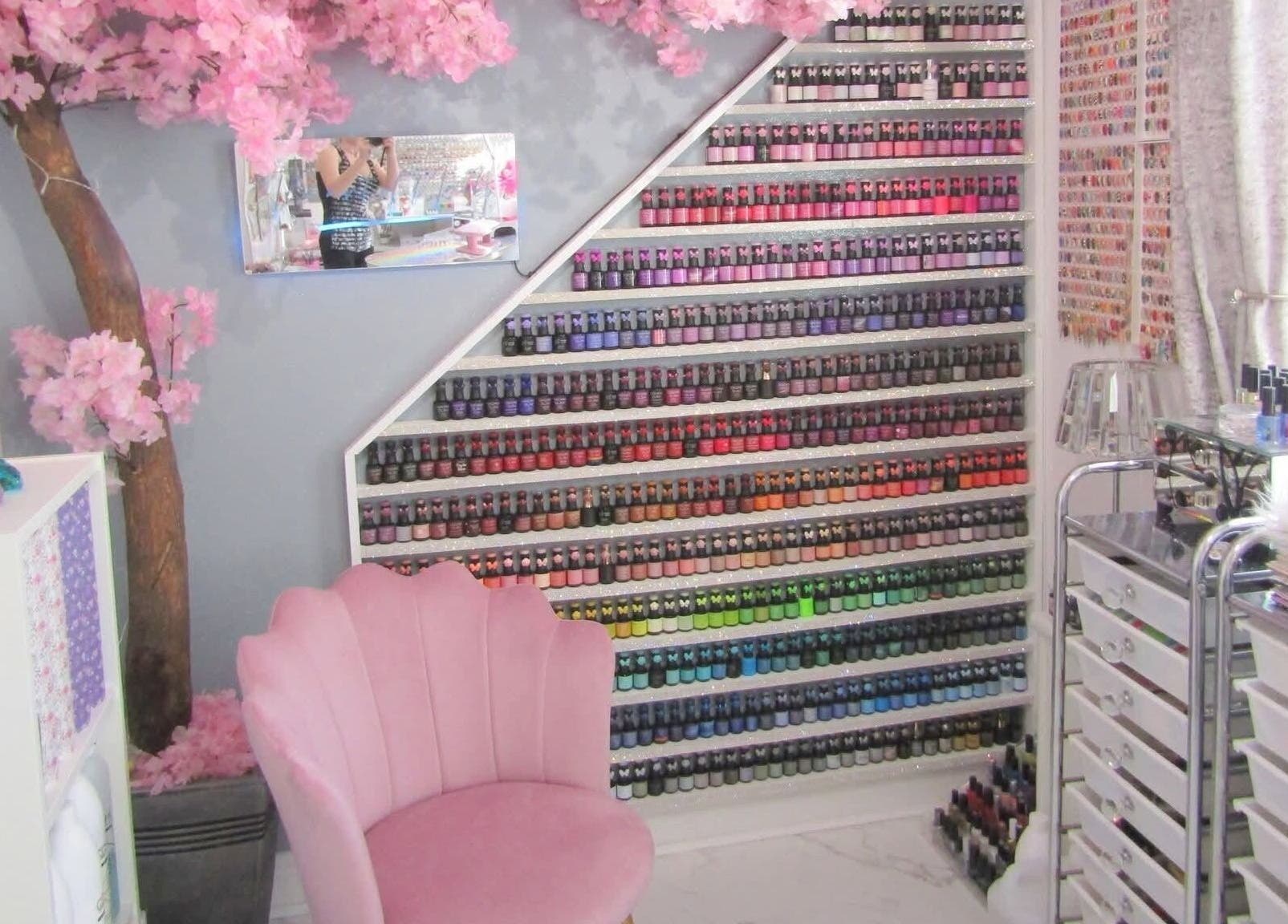 Colorful nail polish display at The Art of Nails, Trowbridge, England, GB. Elegantly styled beauty salon.