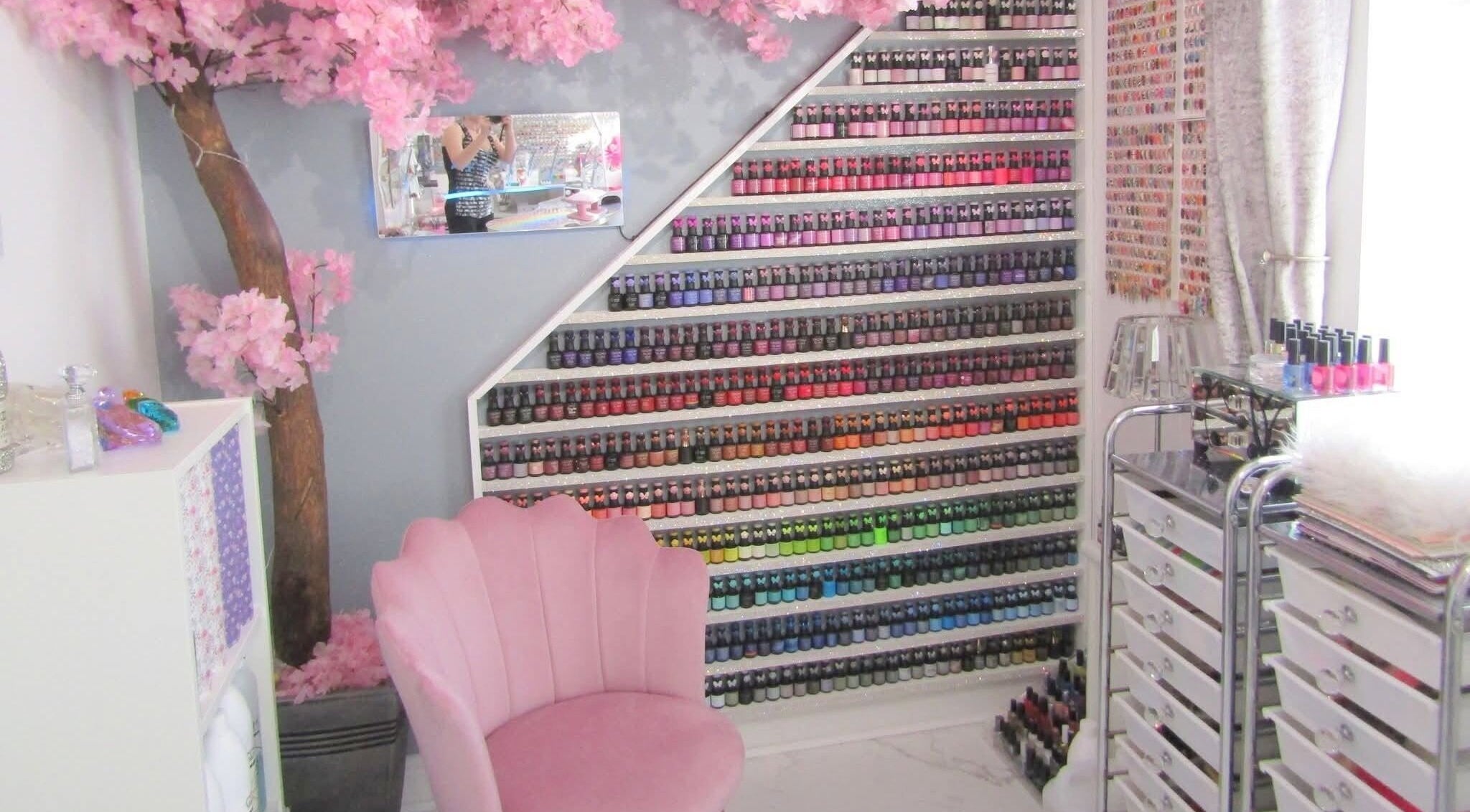 Colorful nail polish display at The Art of Nails, Trowbridge, England, GB. Elegantly styled beauty salon.