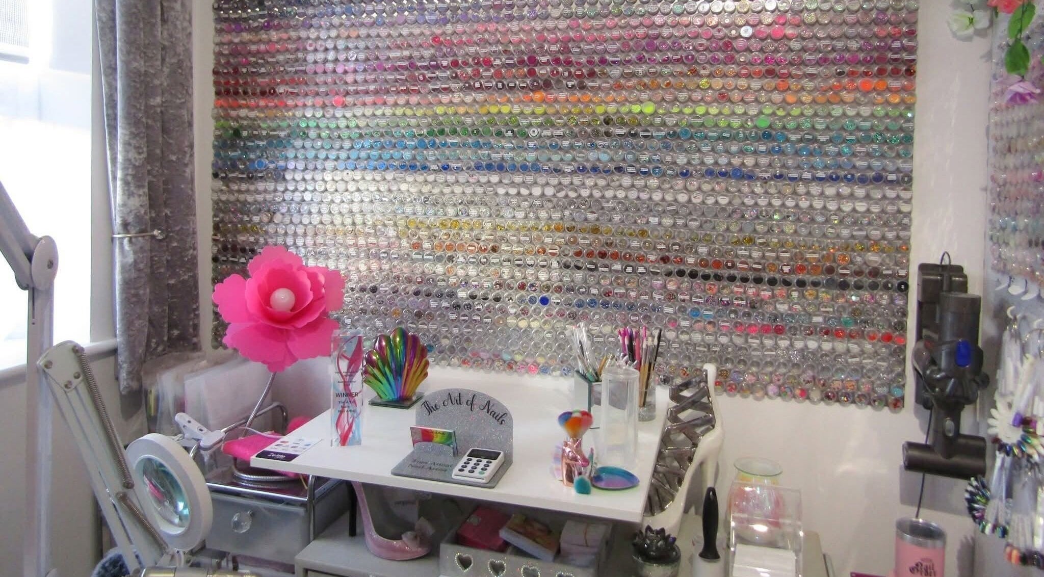 Colorful nail art display wall at The Art of Nails, Trowbridge, England, GB, showcasing vibrant creativity.