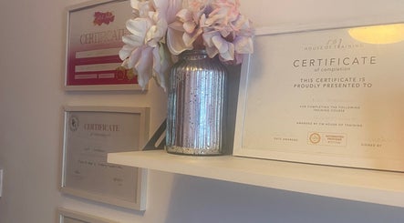 Certificates and floral decor at Lori's Lashes in Whitley Bay, England, GB.