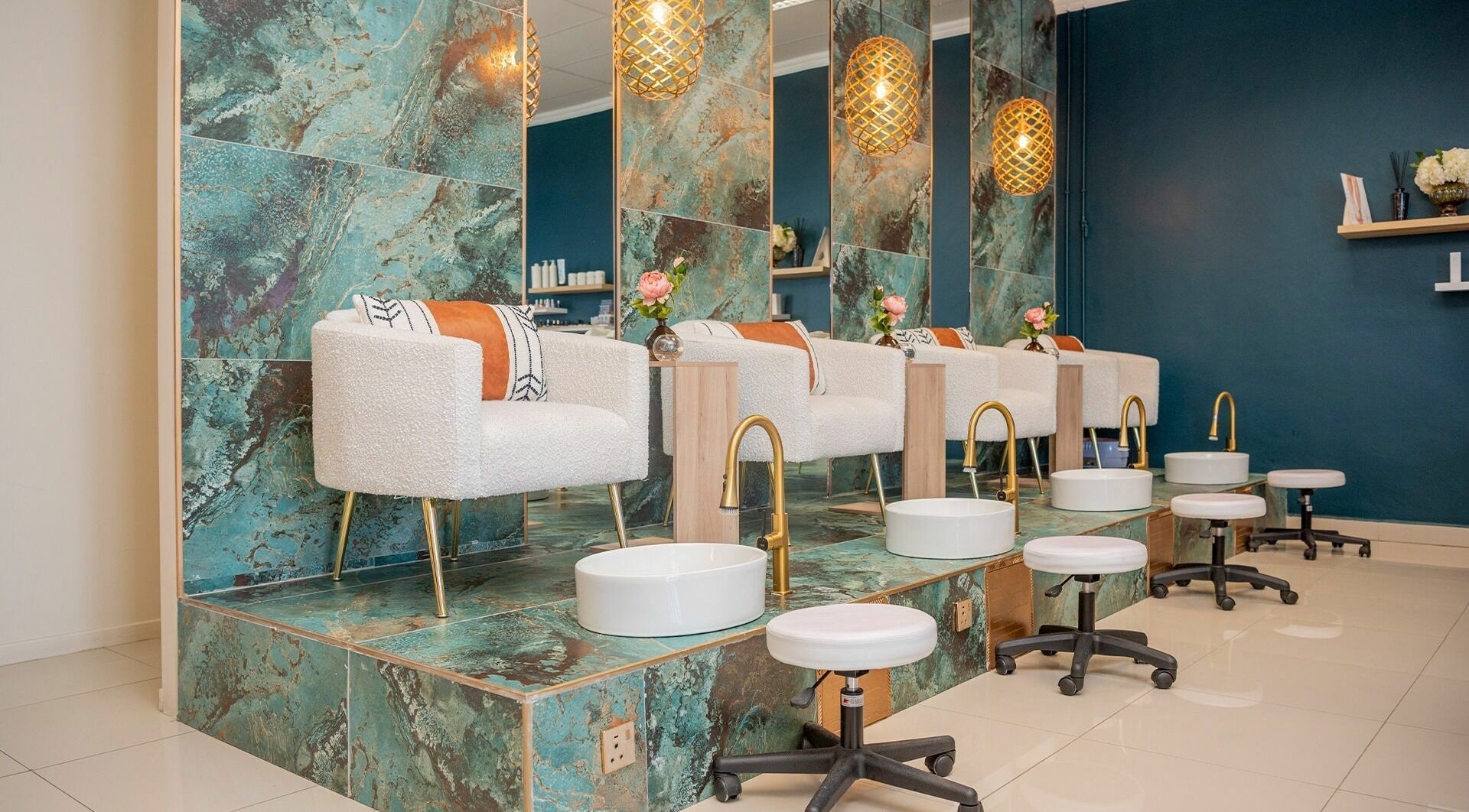 Luxurious pedicure area at Nomlu Nail Bar- Airport Junction, Gaborone, Gaborone City, BW with plush seating.