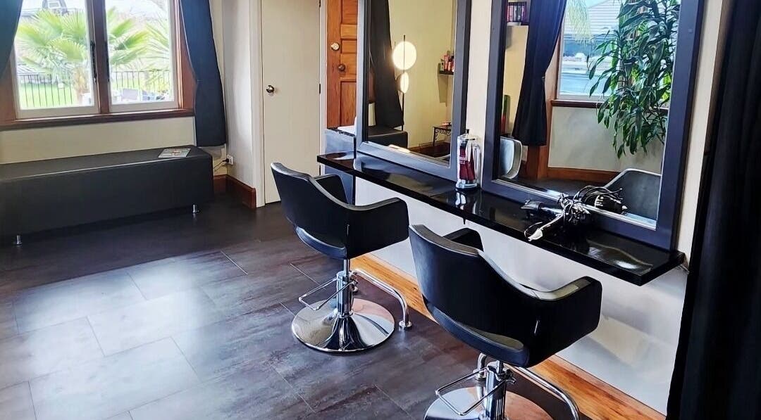 Modern styling chairs and mirrors at Oasis Hair salon in Nelson, Nelson Region, NZ.