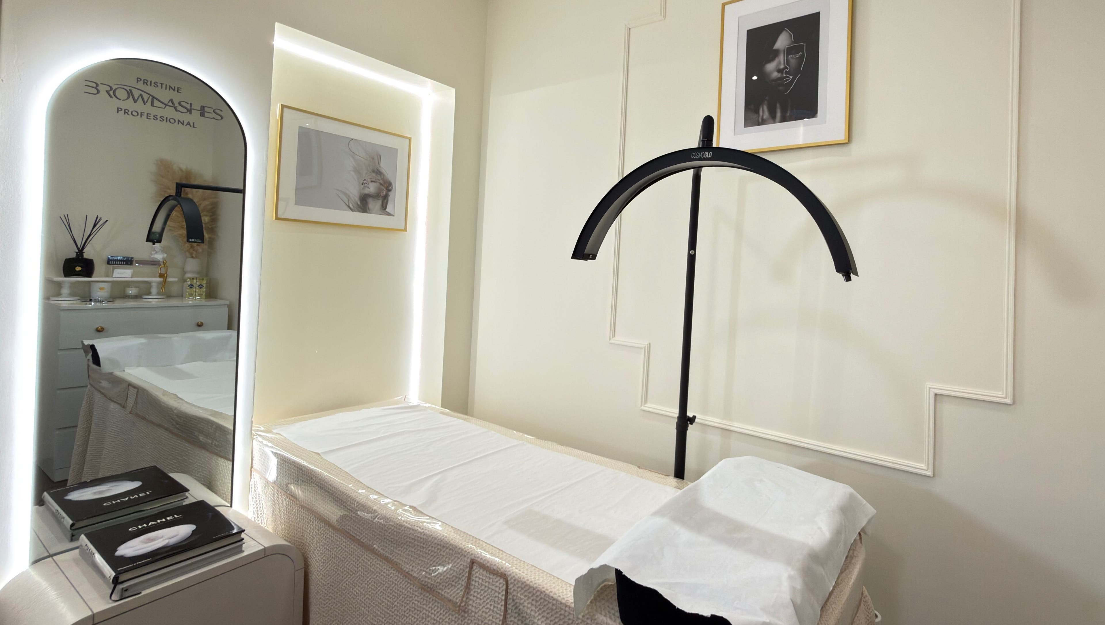 Elegant treatment room at Pristine BrowLashes Professional, London, England, GB, featuring chic decor and lighting.