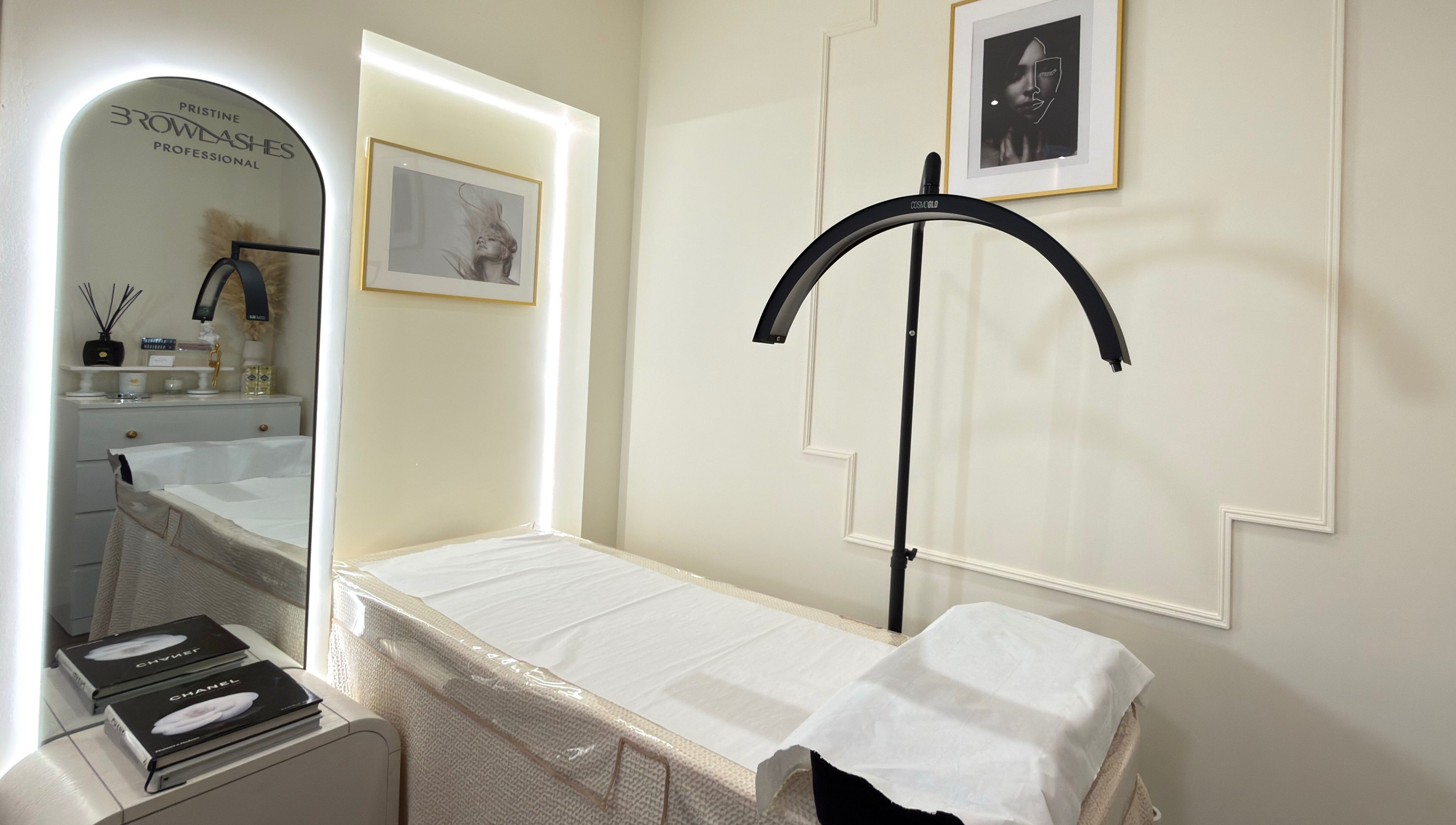 Elegant treatment room at Pristine BrowLashes Professional, London, England, GB, featuring chic decor and lighting.