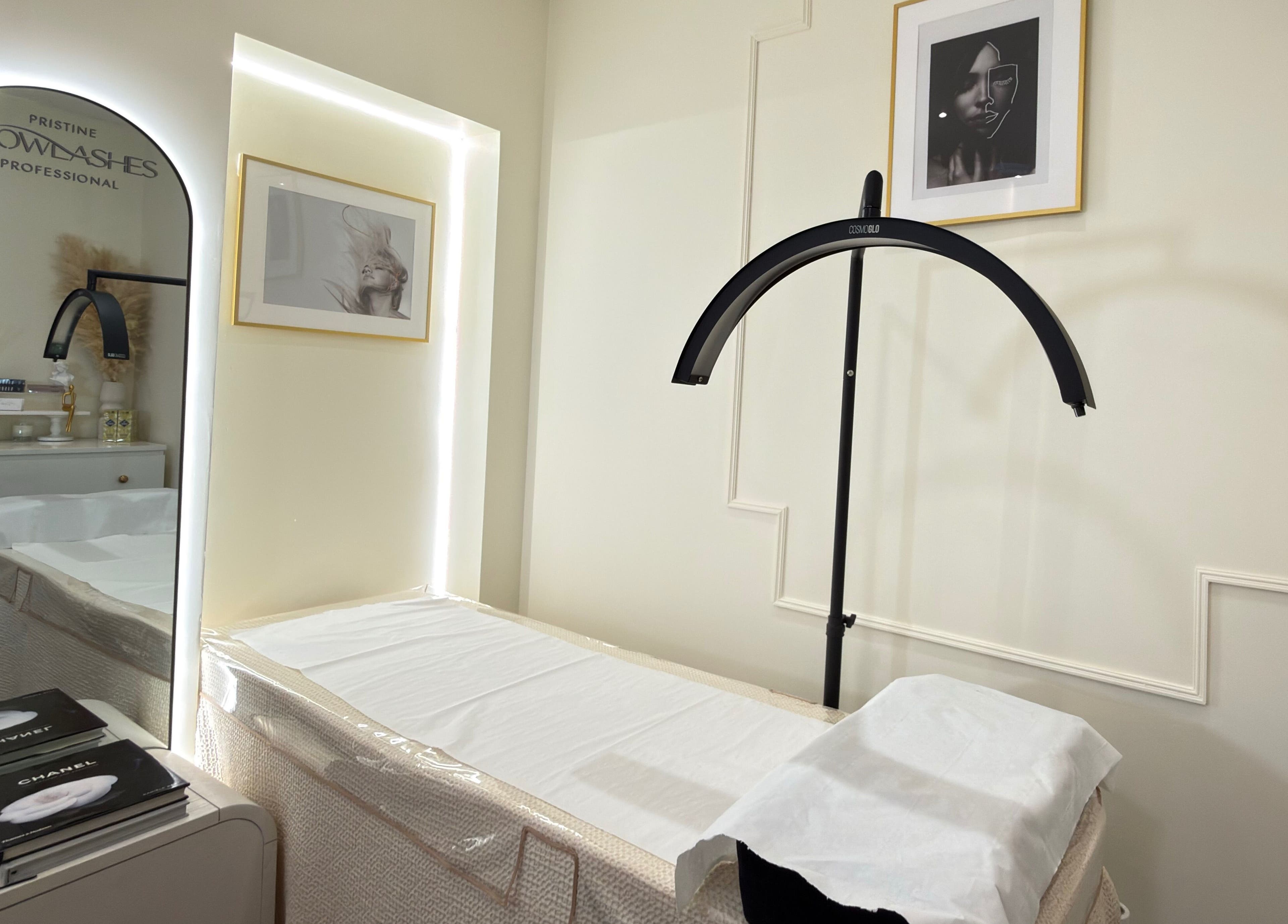 Elegant treatment room at Pristine BrowLashes Professional, London, England, GB, featuring chic decor and lighting.