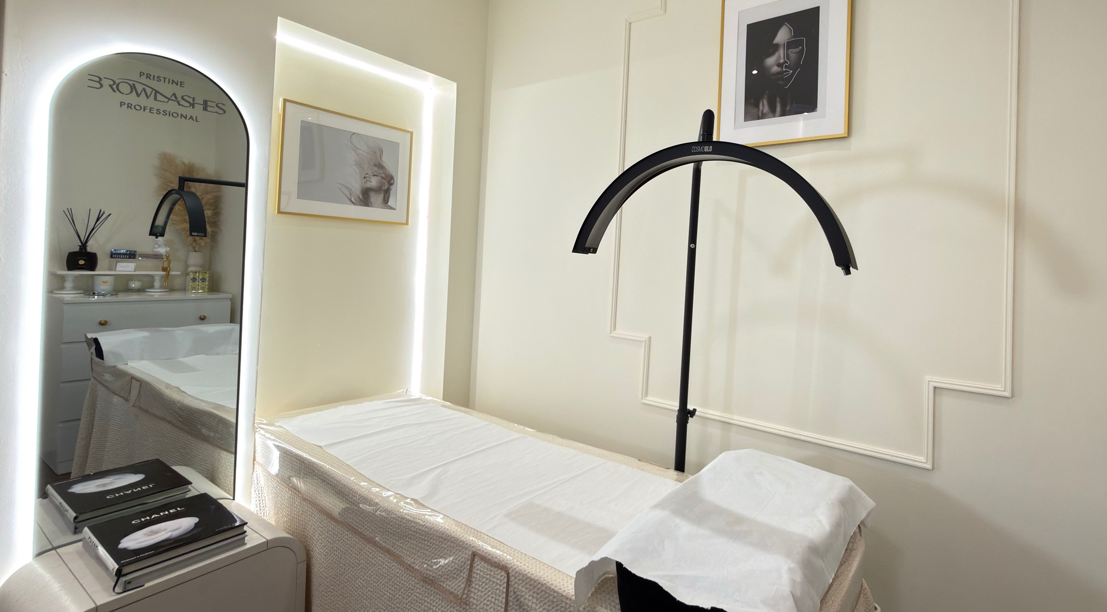 Elegant treatment room at Pristine BrowLashes Professional, London, England, GB, featuring chic decor and lighting.