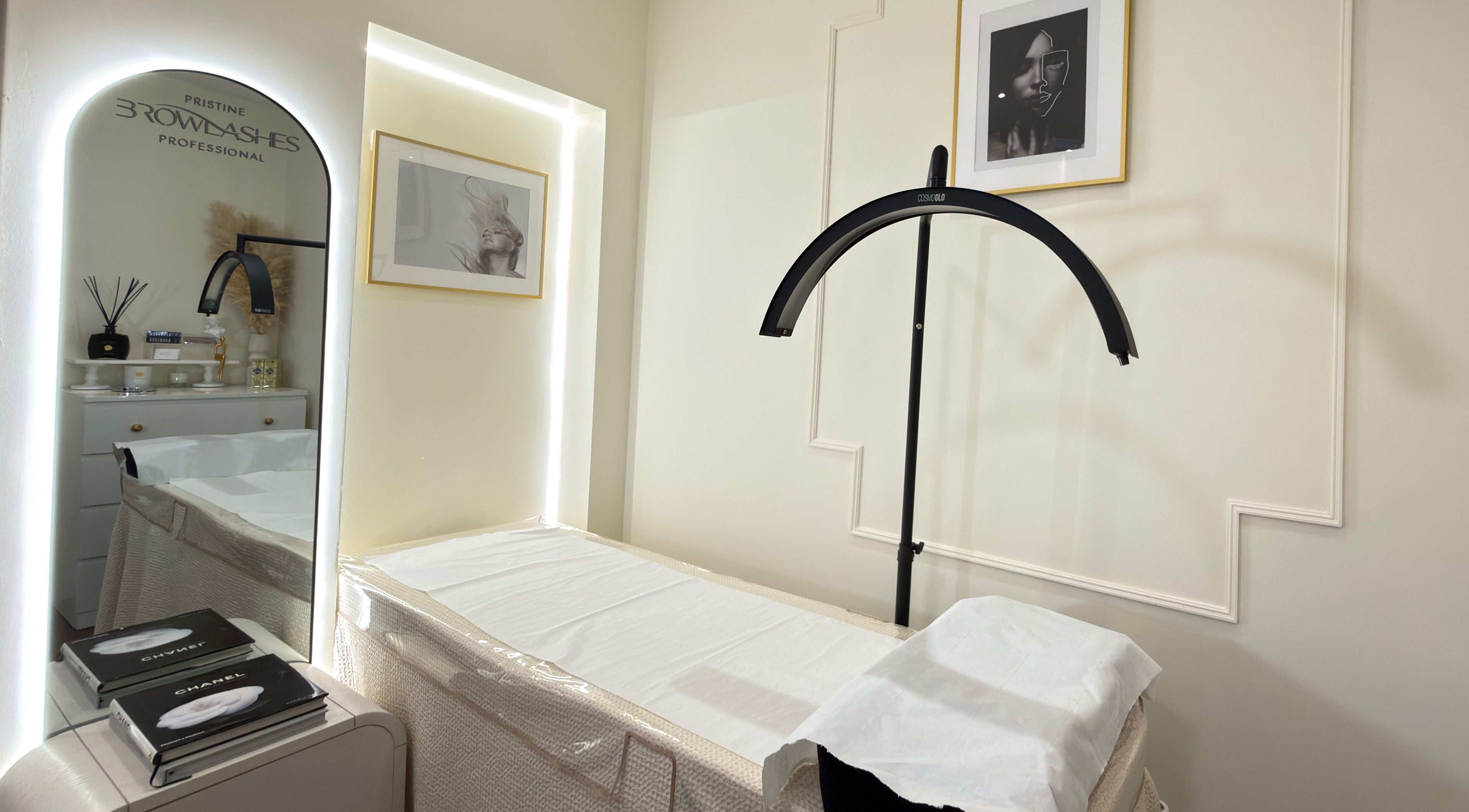 Elegant treatment room at Pristine BrowLashes Professional, London, England, GB, featuring chic decor and lighting.