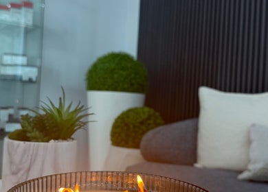 Cozy lounge area with candle at Bliss Spa & Wellness, San Juan, San Juan, PR offering relaxing ambiance.