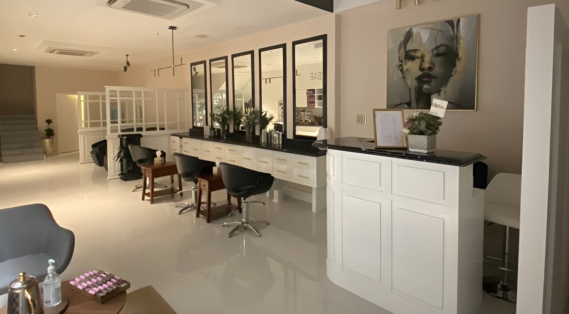 Admire Beauty Lounge in Al Khobar, Eastern Province, SA, displays a chic salon interior with sleek chairs and modern decor.