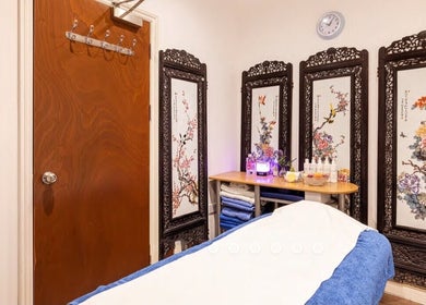 Serene therapy room at Reborn Clinic, featuring decorative screens, London, England, GB.
