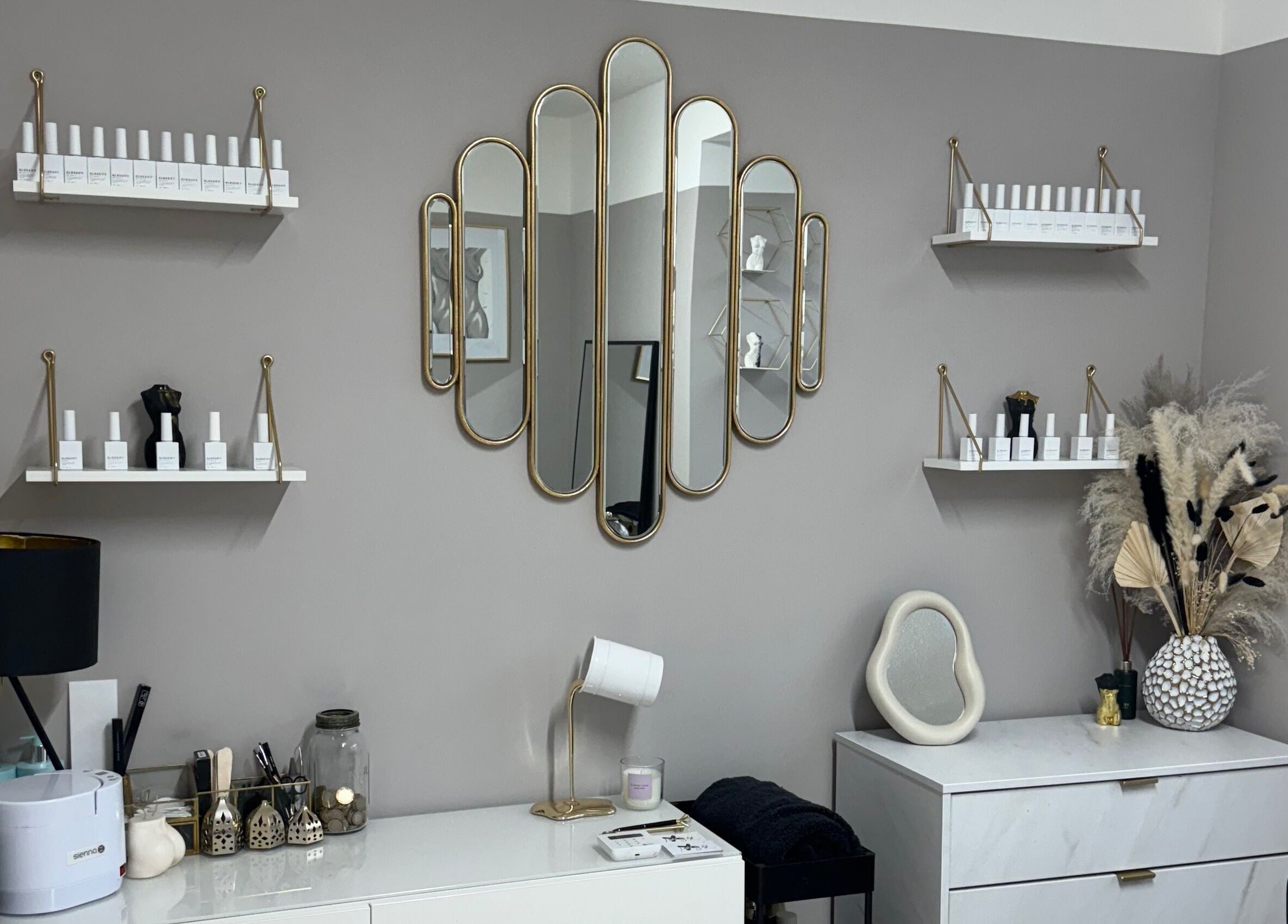 Elegant interior of Nailed by Lish in Sudbury, England, GB featuring stylish mirrors and decor.