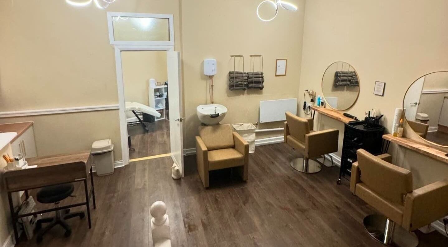 Elegant salon interior at Look and Lash, Alnwick, England, GB with modern chairs and mirrors.