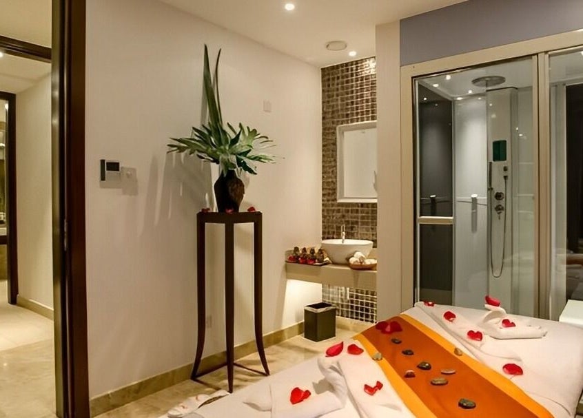 Luxurious spa room at Spa By Xenaxia At Movenpick, Nairobi, Nairobi County, KE, featuring a massage table.