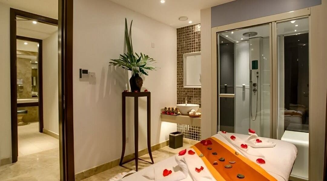 Luxurious spa room at Spa By Xenaxia At Movenpick, Nairobi, Nairobi County, KE, featuring a massage table.