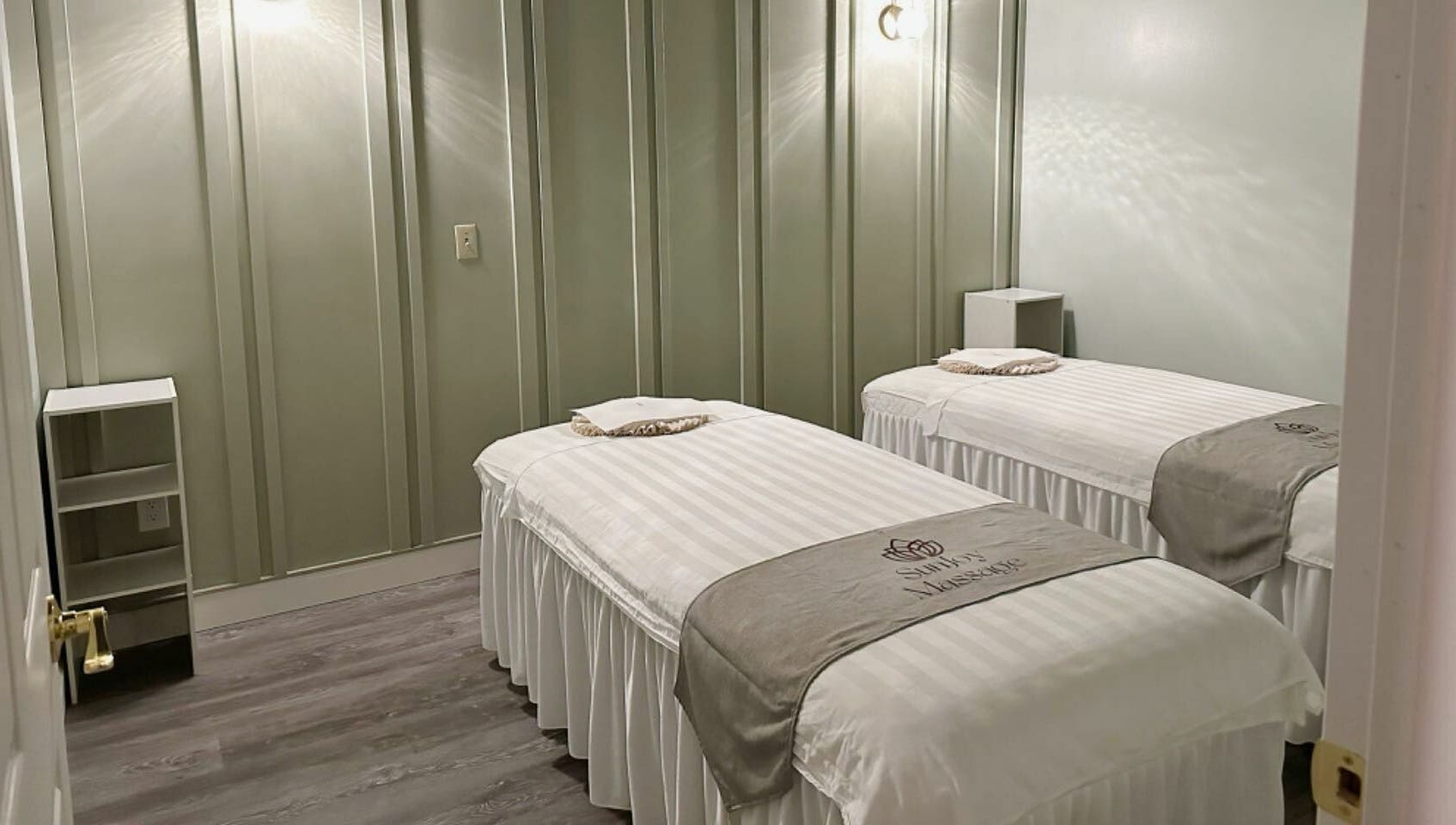 Calming massage room with twin beds at Sun Joy Massage Spa, Wichita, Kansas, US, offering a serene ambiance.