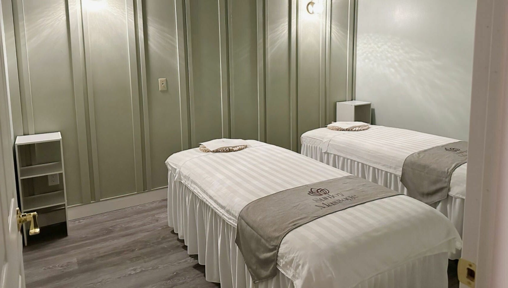 Calming massage room with twin beds at Sun Joy Massage Spa, Wichita, Kansas, US, offering a serene ambiance.
