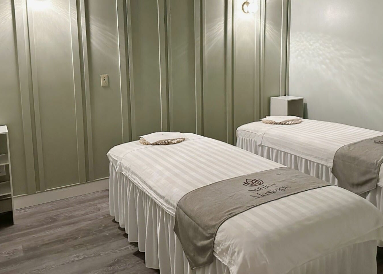 Calming massage room with twin beds at Sun Joy Massage Spa, Wichita, Kansas, US, offering a serene ambiance.