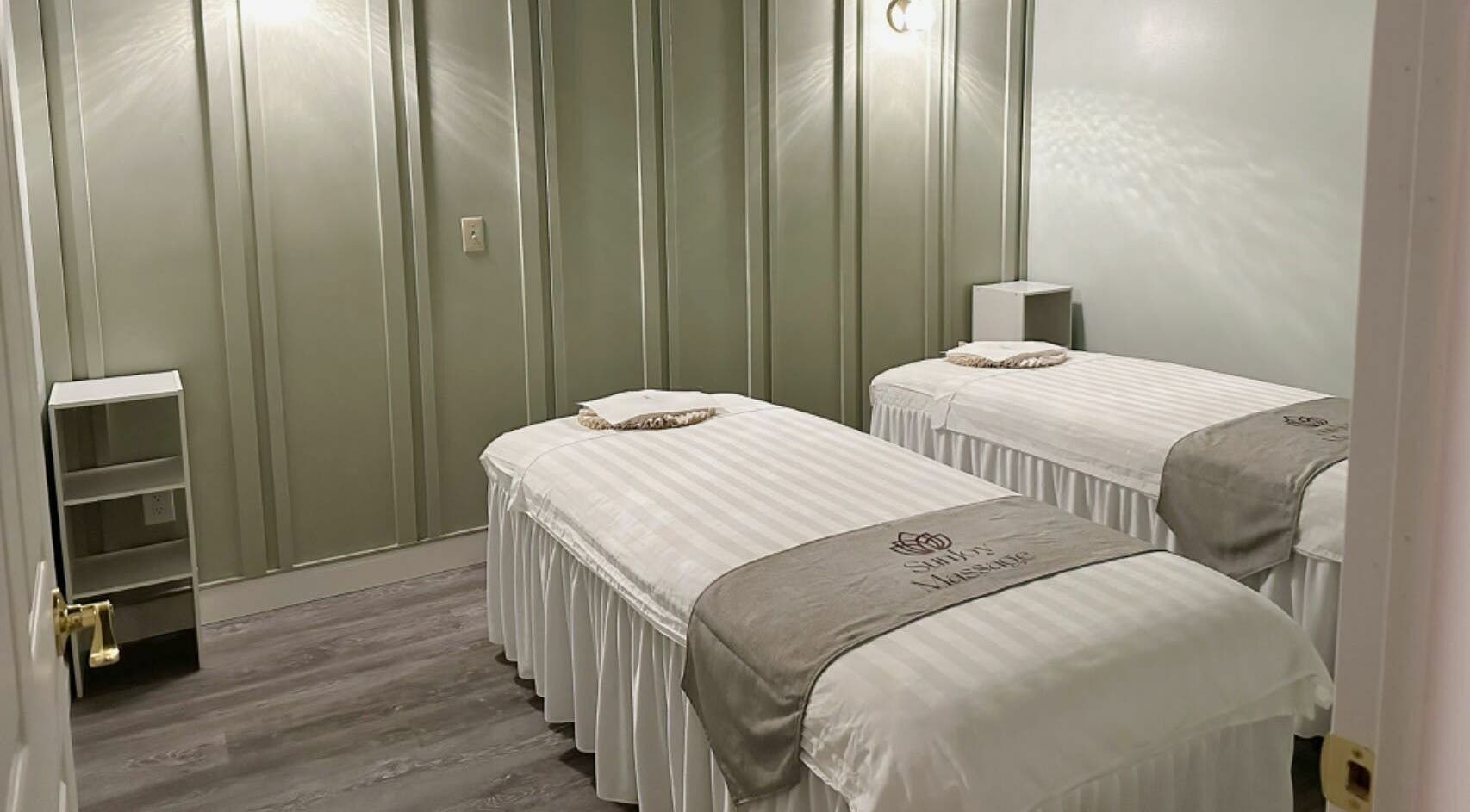 Calming massage room with twin beds at Sun Joy Massage Spa, Wichita, Kansas, US, offering a serene ambiance.