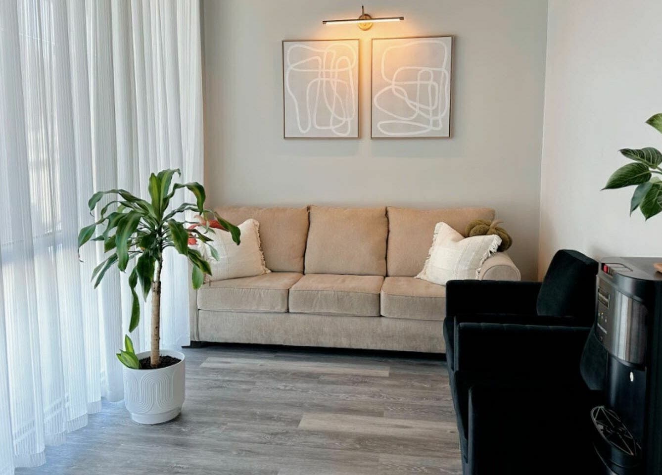 Comfortable seating and decor in Sun Joy Massage Spa's lounge, Wichita, Kansas, US.