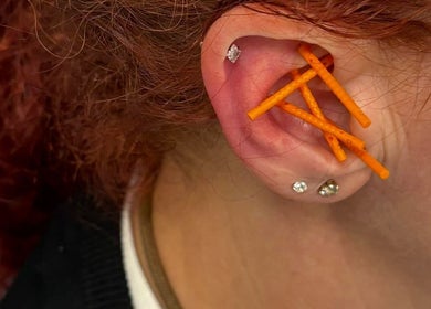 Close-up of ear acupuncture at Deanna Thomas Acupuncture & Wellbeing, Middlesbrough, England, GB.