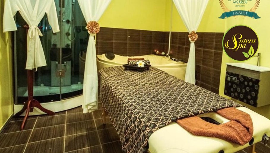 Relaxation room at Sutera Spa Kemaman in Chukai, Terengganu, MY featuring massage table and luxurious decor.