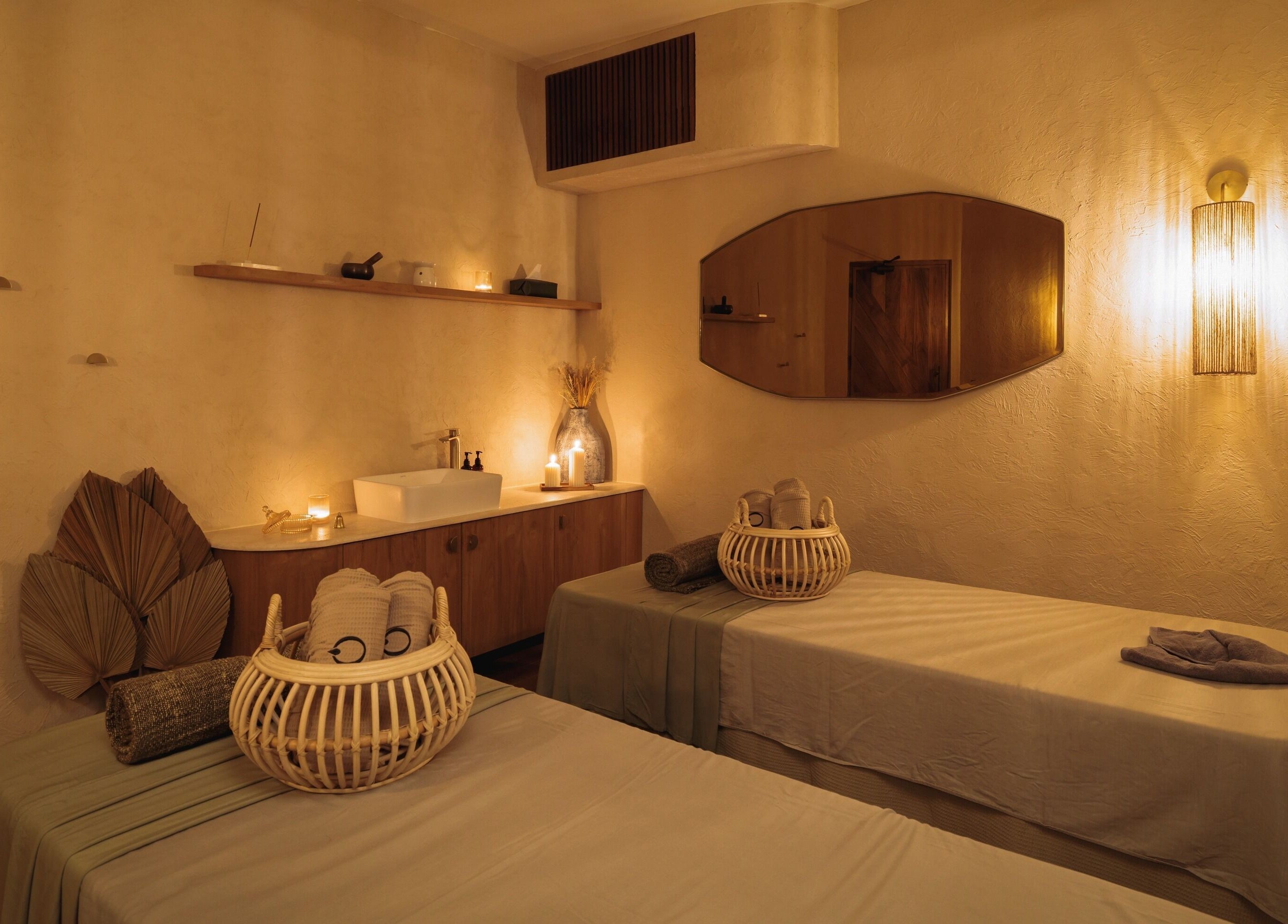 Relaxing massage room at You Spa Umalas in Bali, Bali, ID featuring warm lighting and cozy decor.
