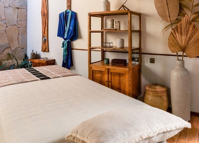 Serene spa room at You Spa Gili Trawangan located in Nusa Tenggara occidental, ID, featuring massage table and decor.