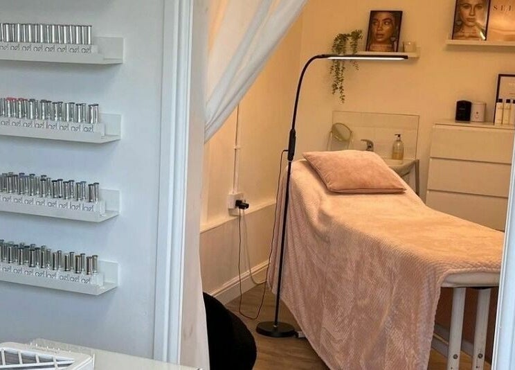 Relaxing spa room at Stef Hayes Hair in Bude, England, GB, showcasing a tranquil treatment bed.