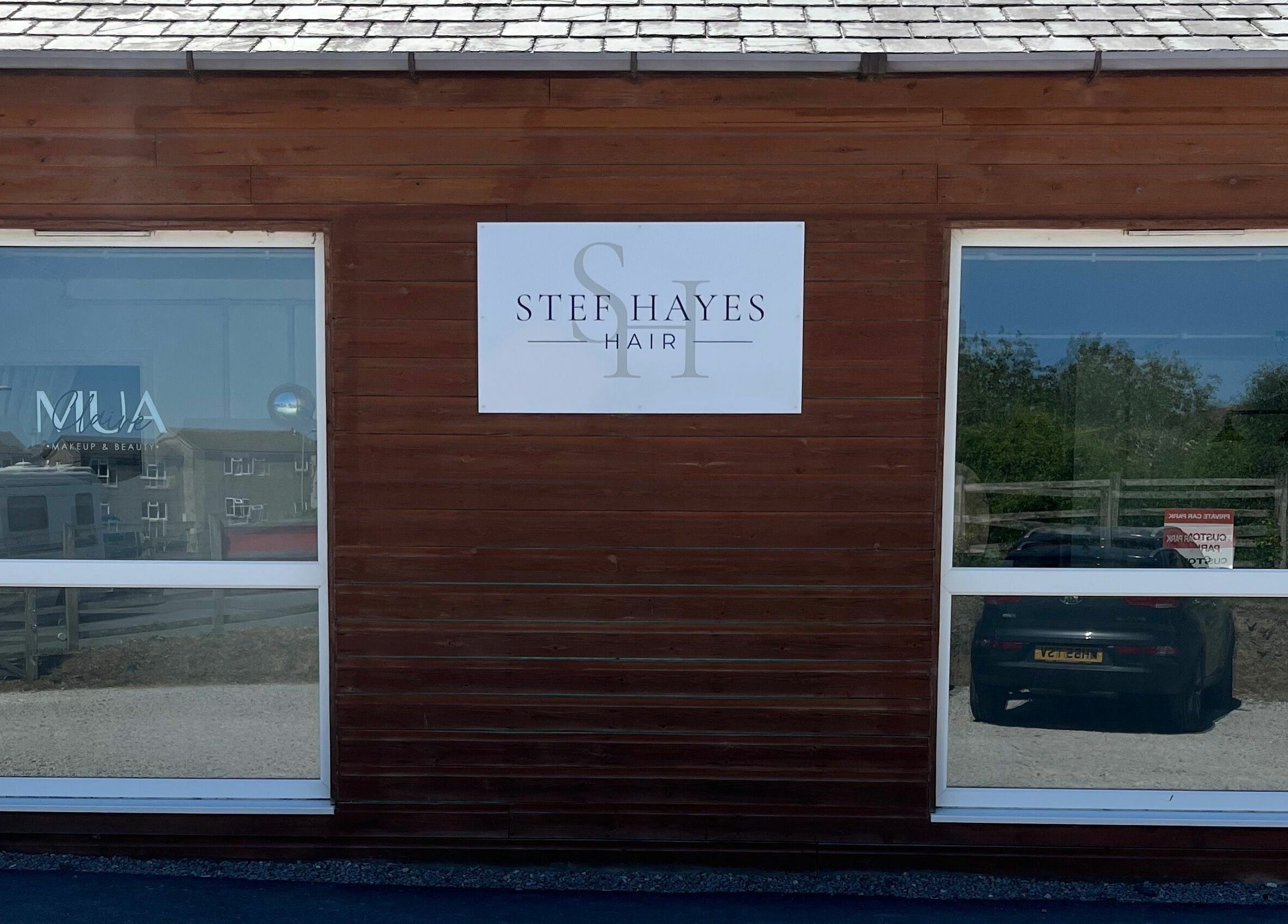Exterior view of Stef Hayes Hair studio in Bude, England, GB, showcasing its professional signage.