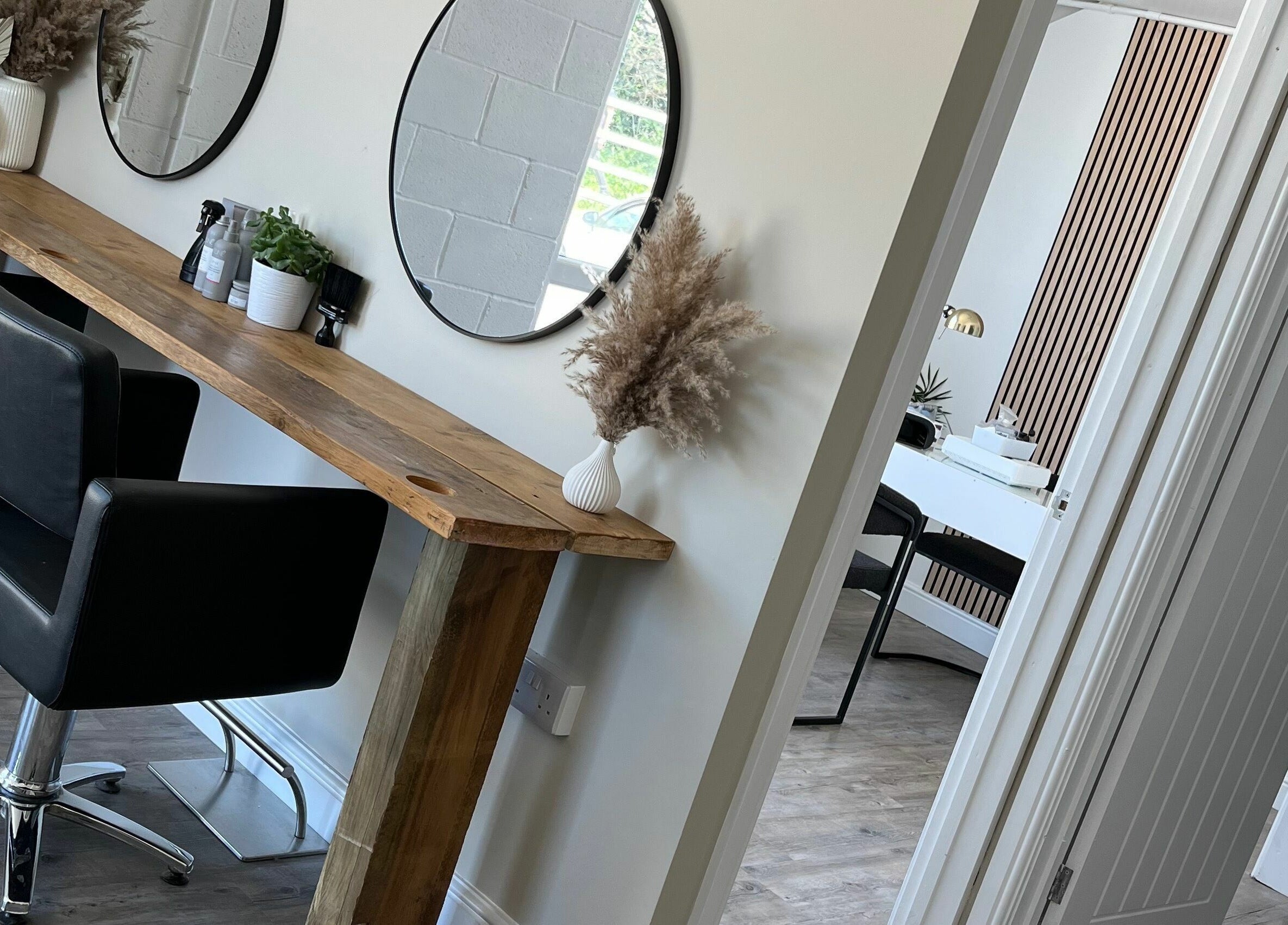 Modern styling chairs and mirrors at Stef Hayes Hair, Bude, England, GB.
