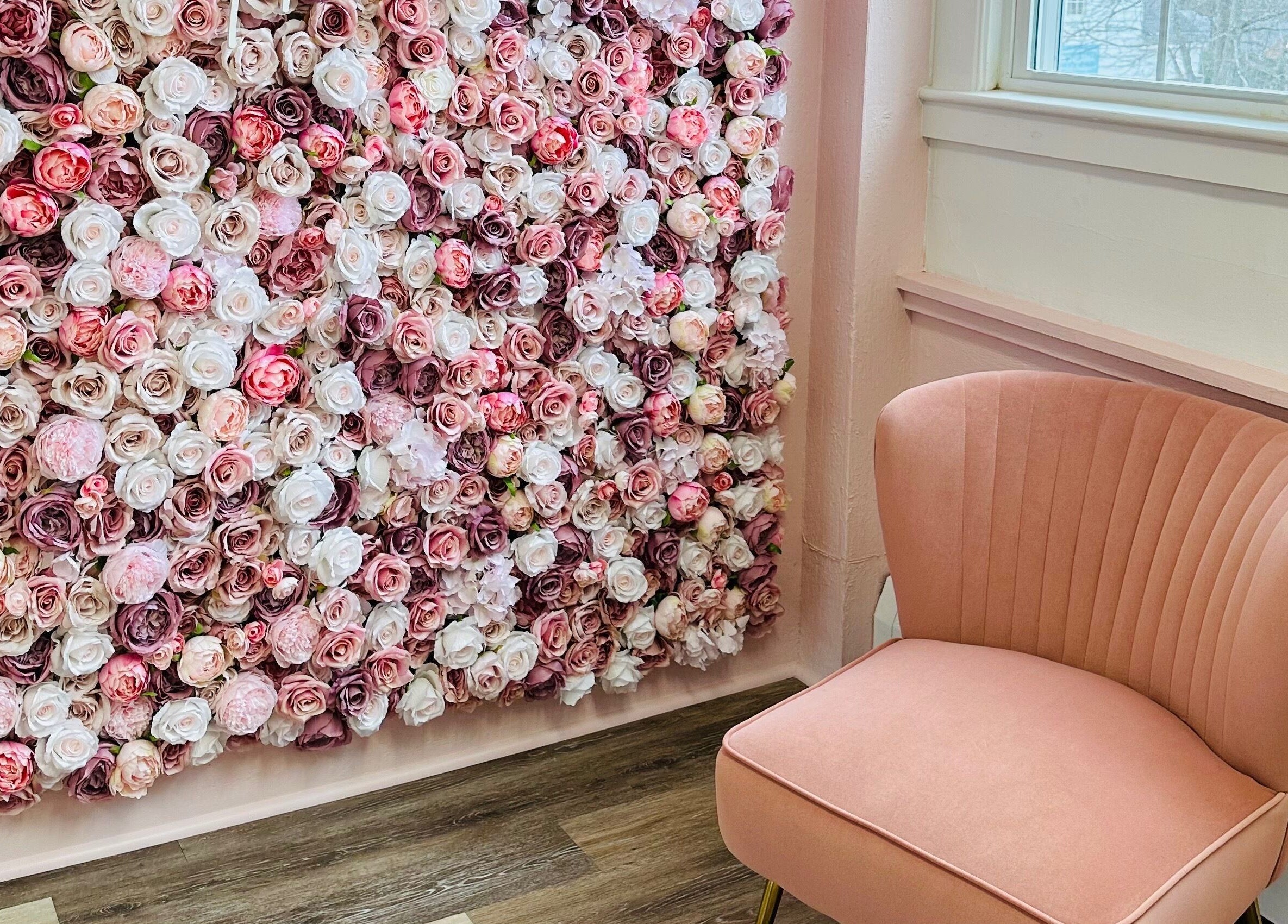 Elegant pink chair and rose wall at The Stately Rose Beauty Studio, Avon, Connecticut, US.