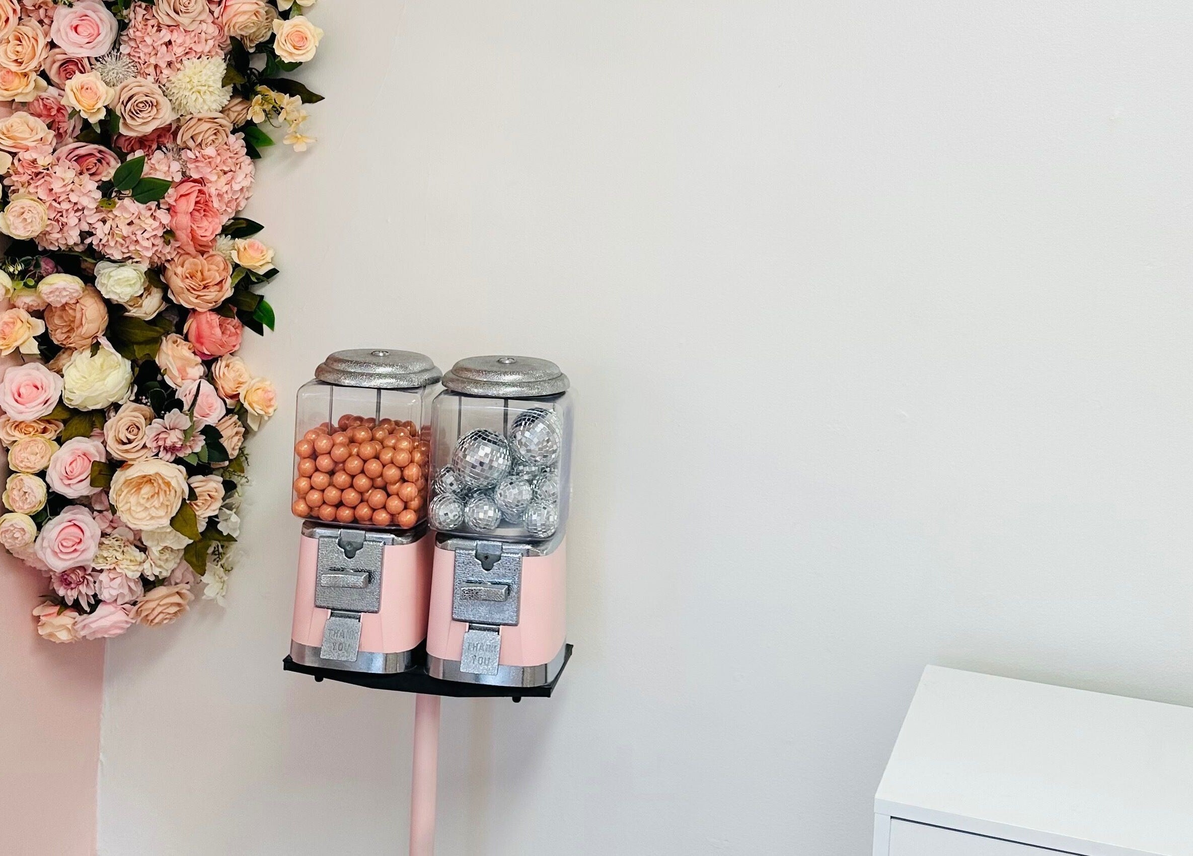 Chic floral decor and candy dispensers at The Stately Rose Beauty Studio, Avon, Connecticut, US.