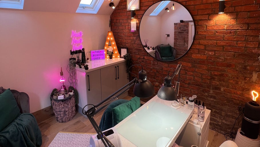 Cozy nail salon interior at The Beauty Shed, Hulland Village, England, GB with neon and stylish decor.
