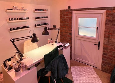Nail station at The Beauty Shed, Hulland Village, England, GB with polish display and cozy ambiance.