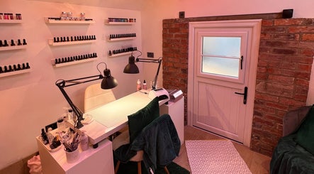 Nail station at The Beauty Shed, Hulland Village, England, GB with polish display and cozy ambiance.