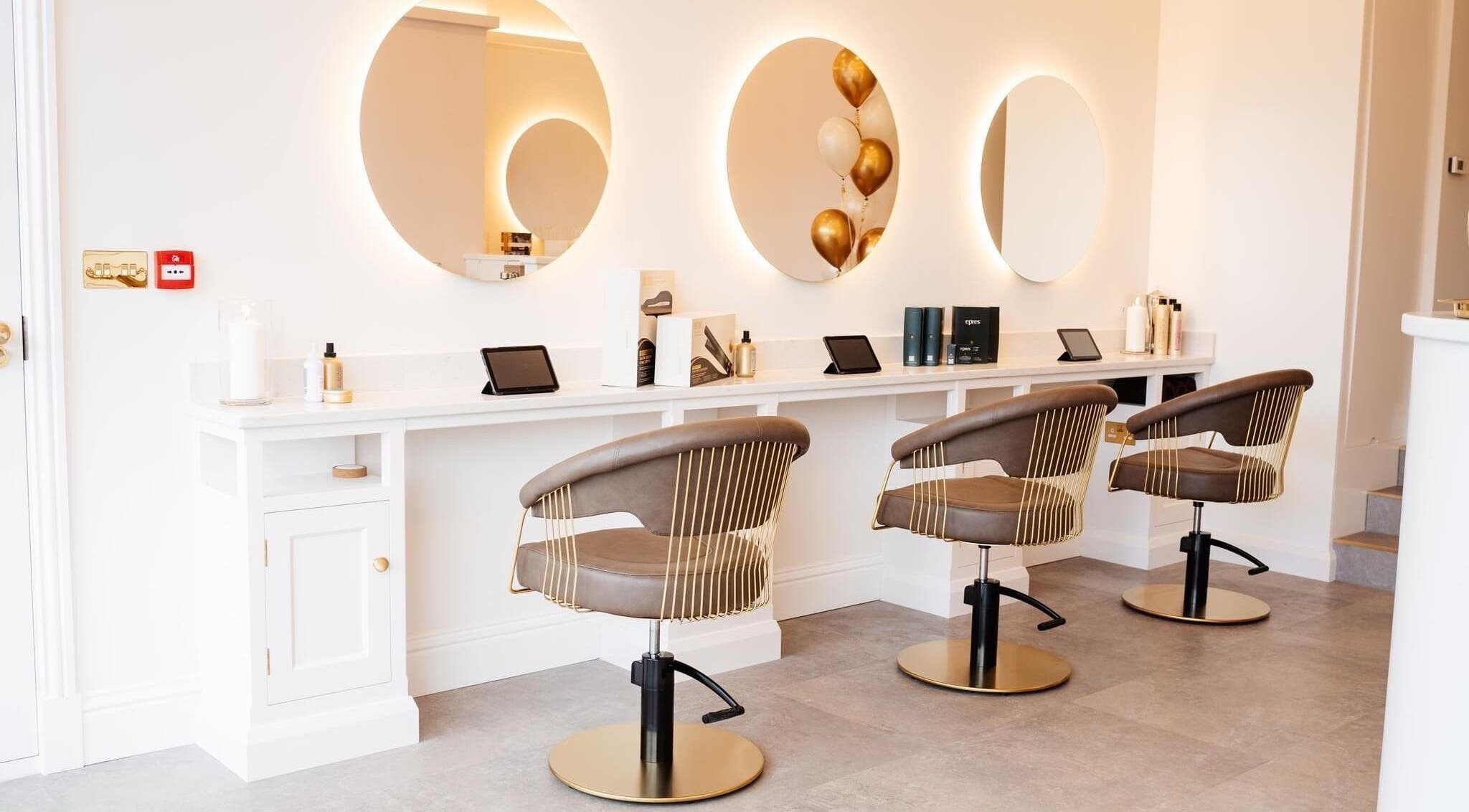 Chic salon chairs and lit mirrors at Beauty in Bloom, Ilkley, England, GB.