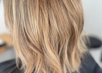 Chic blonde hair styled at Rebecca May salon in Bristol, England, GB, showcasing silky texture and vibrant color.