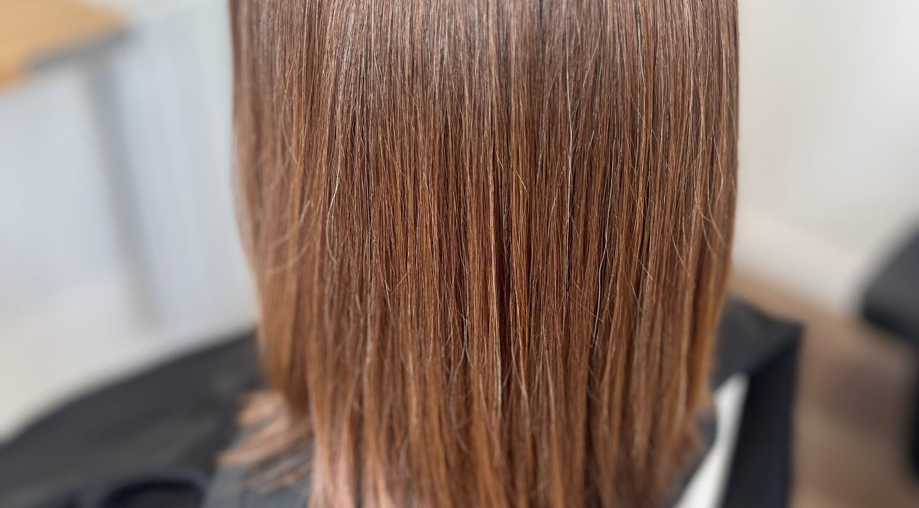 Smooth brunette hair at Rebecca May salon in Bristol, England, GB showcasing expert styling and care.