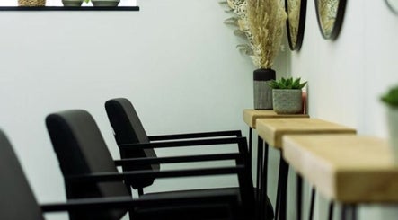 Modern salon chairs and decor at R&R Organic Hair in London, England, GB.