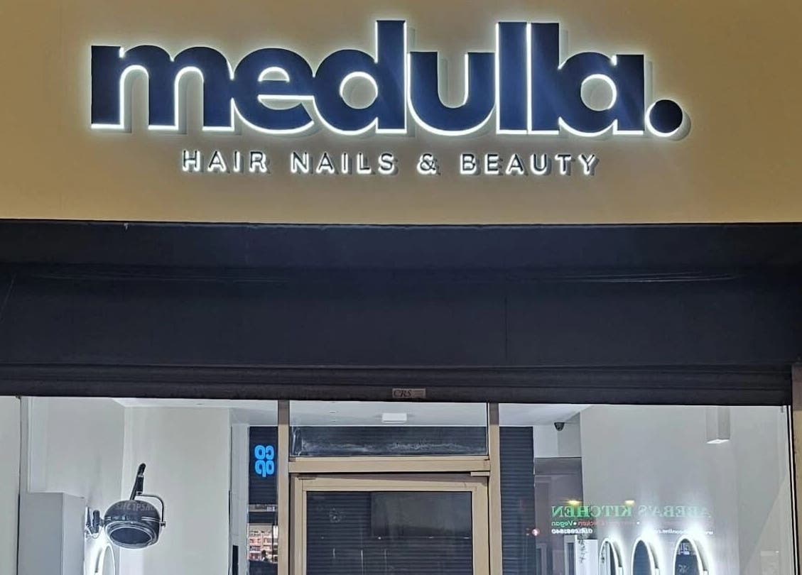 Louise Doherty Beauty and Nails entrance in Glasgow, Scotland, GB with stylish sign.