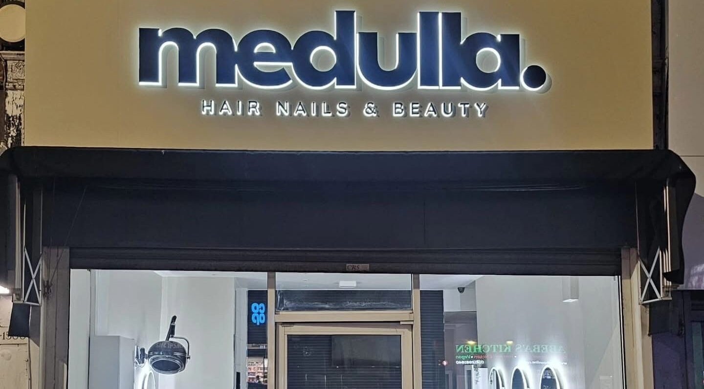Louise Doherty Beauty and Nails entrance in Glasgow, Scotland, GB with stylish sign.