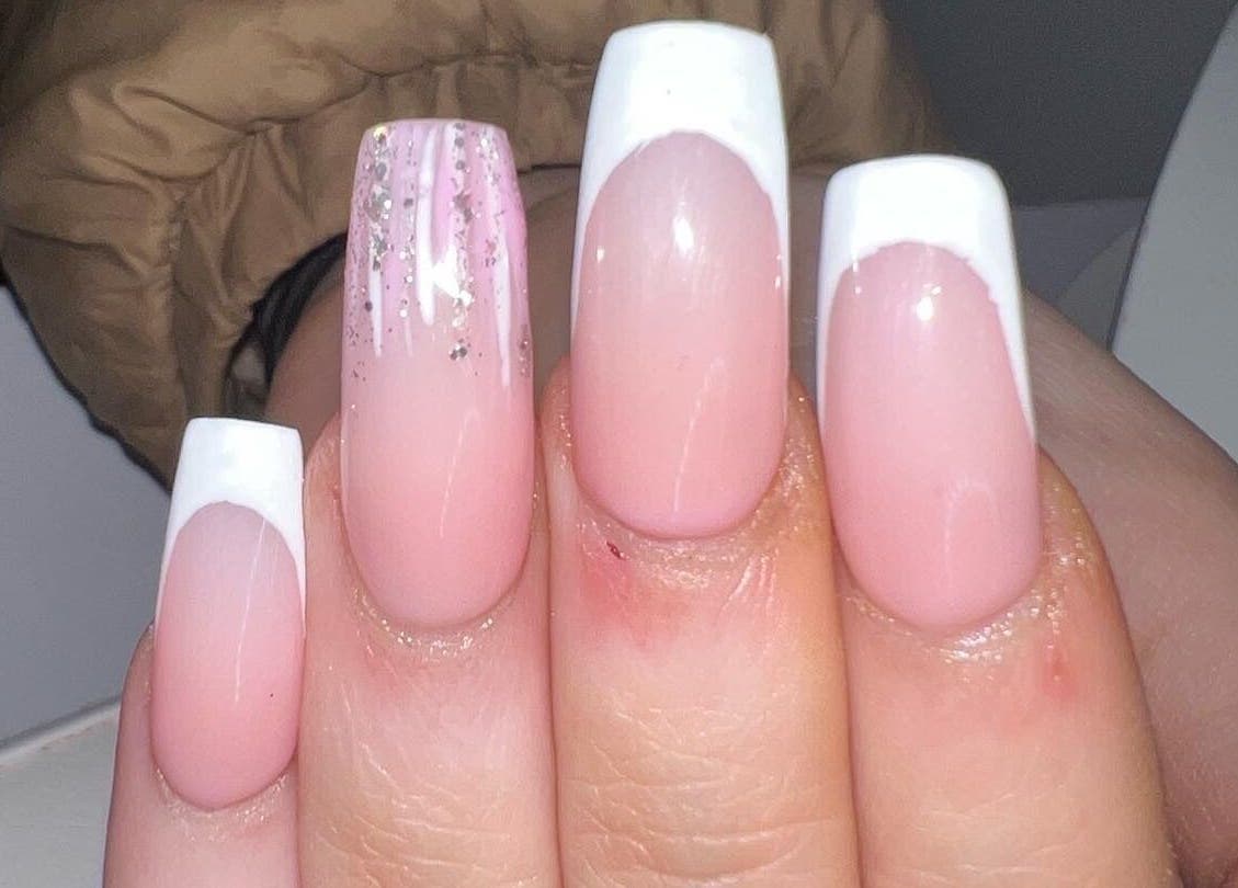 French manicure with glitter at Louise Doherty Beauty and Nails, Glasgow, Scotland, GB.